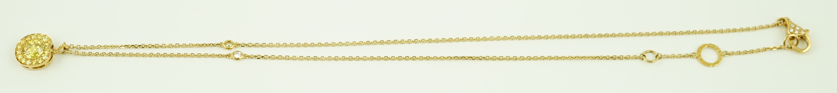 A modern Boodles 18ct gold fancy vivid yellow diamond cluster set pendant necklace on a two stone diamond set chain, with clasp and Boodles ring set with small brilliants